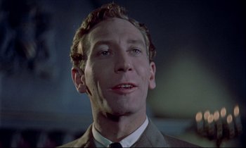 Movie still from “Horror of Dracula” (1958), directed by Terence Fisher – A person wearing a suit and tie; Close Up shot, Low angle