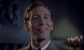 Movie still from “Horror of Dracula” (1958), directed by Terence Fisher – A person wearing a suit and tie; Close Up shot, Low angle