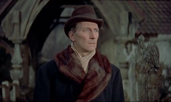 Movie still from “Horror of Dracula” (1958), directed by Terence Fisher – A man wearing a hat and a fur scarf; Close Up shot, Low angle
