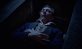 Movie still from “Horror of Dracula” (1958), directed by Terence Fisher – A man laying on the ground with his hands on his chest; Medium shot, Overhead angle
