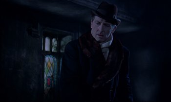 Movie still from “Horror of Dracula” (1958), directed by Terence Fisher – A man wearing a hat and a scarf; Medium shot, Low angle