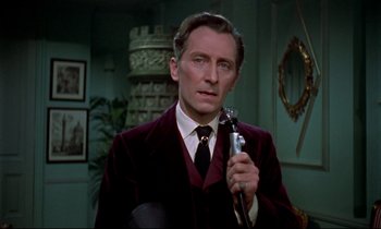 Movie still from “Horror of Dracula” (1958), directed by Terence Fisher – A man in a suit and tie holding a microphone; Close Up shot, Over the shoulder angle