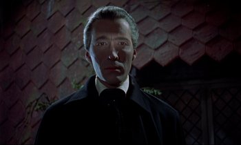 Movie still from “Horror of Dracula” (1958), directed by Terence Fisher – A person wearing a suit and tie; Close Up shot, Low angle