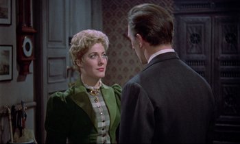 Movie still from “Horror of Dracula” (1958), directed by Terence Fisher – A man and a woman are talking to each other; Medium shot, Over the shoulder angle