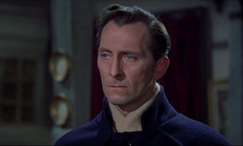 Movie still from “Horror of Dracula” (1958), directed by Terence Fisher – A person wearing a suit and tie; Close Up shot, Over the shoulder angle
