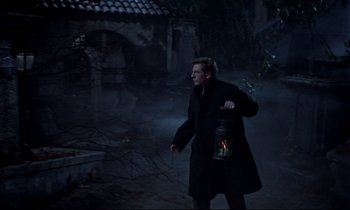 Movie still from “Horror of Dracula” (1958), directed by Terence Fisher – A man walking in the dark holding a lantern; Wide shot, High angle