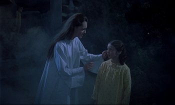 Movie still from “Horror of Dracula” (1958), directed by Terence Fisher – A young girl and an older woman in a dark forest; Medium shot, Over the shoulder angle