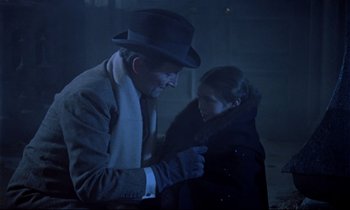 Movie still from “Horror of Dracula” (1958), directed by Terence Fisher – A man and a woman are standing in the dark; Medium shot, Over the shoulder angle