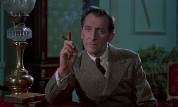 Movie still from “Horror of Dracula” (1958), directed by Terence Fisher – A man sitting at a table holding a cigarette in his hand; Close Up shot, Over the shoulder angle