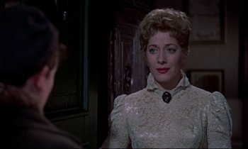 Movie still from “Horror of Dracula” (1958), directed by Terence Fisher – A person wearing a white dress; Close Up shot, Over the shoulder angle