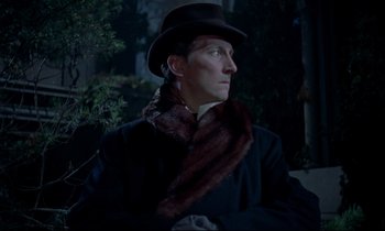 Movie still from “Horror of Dracula” (1958), directed by Terence Fisher – A man wearing a hat and a fur scarf; Close Up shot, Low angle