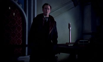 Movie still from “Horror of Dracula” (1958), directed by Terence Fisher – A man standing in front of a table with a brush; Medium shot, Low angle