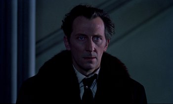 Movie still from “Horror of Dracula” (1958), directed by Terence Fisher – A person wearing a suit and tie; Close Up shot, Low angle