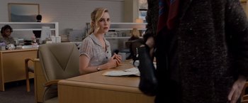 Movie still from “Drag Me to Hell” (2009), directed by Sam Raimi – A woman sitting at a table in front of a man; Medium shot, Over the shoulder angle