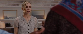 Movie still from “Drag Me to Hell” (2009), directed by Sam Raimi – A woman in a white and black dress talking to a man; Close Up shot, Over the shoulder angle