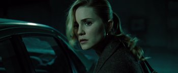 Movie still from “Drag Me to Hell” (2009), directed by Sam Raimi – A beautiful woman with blonde hair looking into a mirror; Close Up shot, Low angle