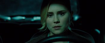 Movie still from “Drag Me to Hell” (2009), directed by Sam Raimi – A woman sitting in the drivers seat of a car; Close Up shot, Over the shoulder angle