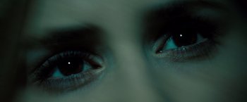 Movie still from “Drag Me to Hell” (2009), directed by Sam Raimi – View of the eyes of a person; Extreme Close Up shot, Overhead angle