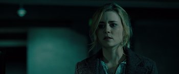 Movie still from “Drag Me to Hell” (2009), directed by Sam Raimi – A woman with blonde hair is looking at the camera; Close Up shot, Over the shoulder angle