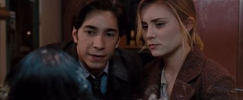 Movie still from “Drag Me to Hell” (2009), directed by Sam Raimi – A man and a woman sitting next to each other; Close Up shot, Over the shoulder angle