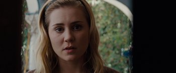 Movie still from “Drag Me to Hell” (2009), directed by Sam Raimi – A person wearing a headband; Close Up shot, Over the shoulder angle