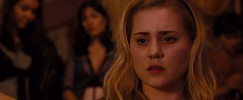 Movie still from “Drag Me to Hell” (2009), directed by Sam Raimi – A woman with long blonde hair looking at the camera; Close Up shot, Over the shoulder angle