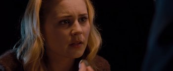 Movie still from “Drag Me to Hell” (2009), directed by Sam Raimi – A person holding something in her hand; Close Up shot, High angle