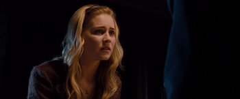 Movie still from “Drag Me to Hell” (2009), directed by Sam Raimi – A young blonde haired woman looking to her left; Close Up shot, Over the shoulder angle