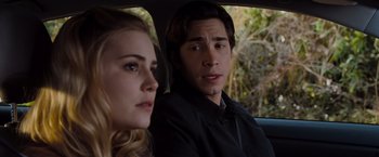 Movie still from “Drag Me to Hell” (2009), directed by Sam Raimi – A man and a woman sitting in the back of a car; Close Up shot, Over the shoulder angle