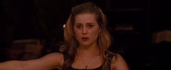 Movie still from “Drag Me to Hell” (2009), directed by Sam Raimi – A person with long hair; Close Up shot, Over the shoulder angle