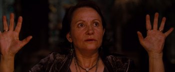 Movie still from “Drag Me to Hell” (2009), directed by Sam Raimi – An older woman looking up at the camera; Close Up shot, Low angle