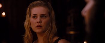 Movie still from “Drag Me to Hell” (2009), directed by Sam Raimi – A person with long blonde hair; Close Up shot, Over the shoulder angle