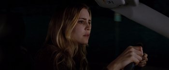 Movie still from “Drag Me to Hell” (2009), directed by Sam Raimi – A woman sitting in a car at night; Close Up shot, Over the shoulder angle