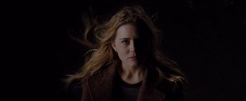 Movie still from “Drag Me to Hell” (2009), directed by Sam Raimi – A woman with long blonde hair in the dark; Close Up shot, Overhead angle