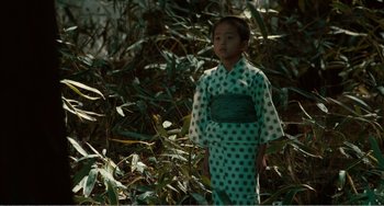 Movie still from “Dreams” (1990), directed by Akira Kurosawa – A little girl wearing a green and white dress; Medium shot, High angle