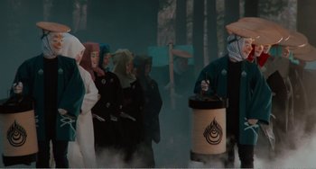 Movie still from “Dreams” (1990), directed by Akira Kurosawa – A group of people standing in front of a fire hydrant; Medium shot, Low angle