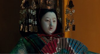 Movie still from “Dreams” (1990), directed by Akira Kurosawa – A statue of an asian woman with a fan in her hand; Close Up shot, Low angle
