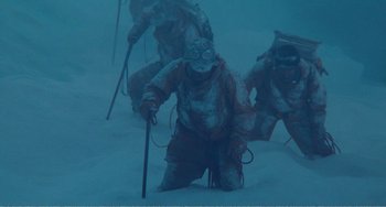 Movie still from “Dreams” (1990), directed by Akira Kurosawa – A group of people on skis in the snow; Wide shot, Low angle