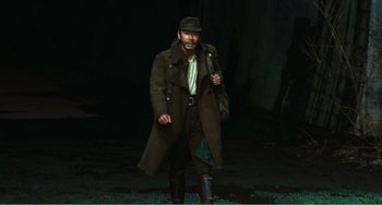 Movie still from “Dreams” (1990), directed by Akira Kurosawa – A man in a brown coat and a hat; Wide shot, High angle