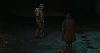 Movie still from “Dreams” (1990), directed by Akira Kurosawa – Two men are standing in the dirt at night; Wide shot, High angle