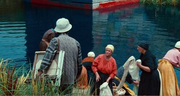 Movie still from “Dreams” (1990), directed by Akira Kurosawa – A group of people standing around a body of water; Wide shot, High angle