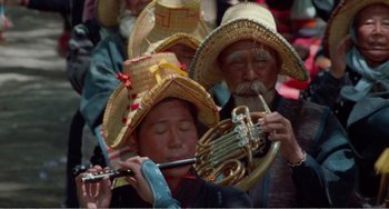 Movie still from “Dreams” (1990), directed by Akira Kurosawa – A group of people wearing hats and playing instruments; Close Up shot, High angle