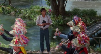 Movie still from “Dreams” (1990), directed by Akira Kurosawa – A man standing next to a body of water; Wide shot, Over the shoulder angle