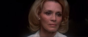 Movie still from “Dressed to Kill” (1980), directed by Brian De Palma – A person wearing a white shirt; Close Up shot, Low angle