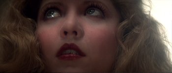 Movie still from “Dressed to Kill” (1980), directed by Brian De Palma – A woman's eyes and lips; Extreme Close Up shot, High angle