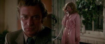 Movie still from “Dressed to Kill” (1980), directed by Brian De Palma – A man and a woman talking on a phone; Close Up shot, Low angle