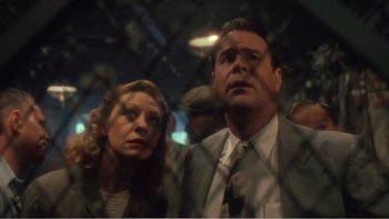 Movie still from “Driving Miss Daisy” (1989), directed by Bruce Beresford – A man and a woman are looking up at something; Close Up shot, Low angle