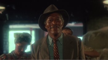 Movie still from “Driving Miss Daisy” (1989), directed by Bruce Beresford – An older man wearing a hat and a suit; Close Up shot, Low angle