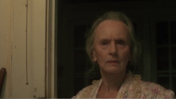 Movie still from “Driving Miss Daisy” (1989), directed by Bruce Beresford – An old woman with a sad look on her face; Close Up shot, Low angle