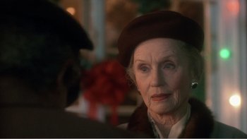 Movie still from “Driving Miss Daisy” (1989), directed by Bruce Beresford – An older woman wearing a brown hat talking to a younger man; Close Up shot, Over the shoulder angle
